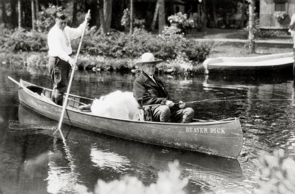 Coolidge fishing on the Brule. No idea what that big wad of white fluff behind him is - cotton candy?