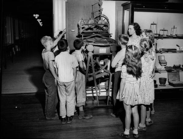 Kids gather around John Muir's study desk Wisconsin Historical Images